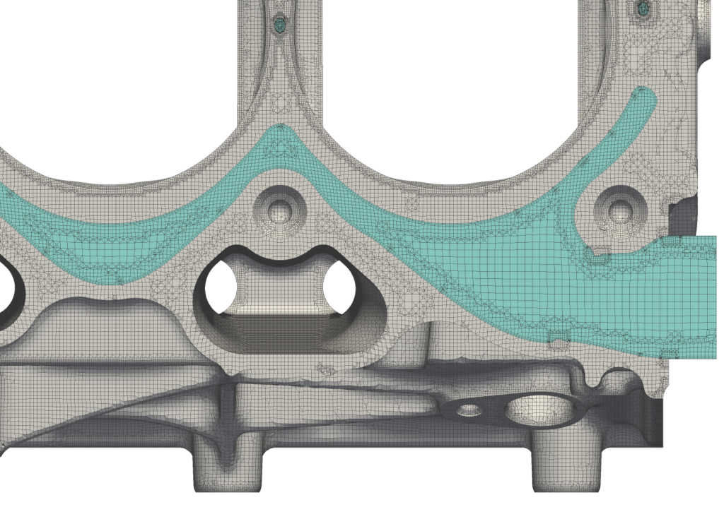 Zoomed in view of the engine block showing the mesh grid of the solid region in grey and the fluid region in blue